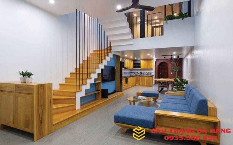 Mẫu cầu thang dọc làm bằng gỗ và sử dụng phần dưới để thiết kế nội thất giúp tiết kiệm diện tích 
